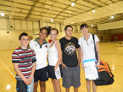 A nutrition and dietetics student manages a team at midnight basketball as part of our community engagement