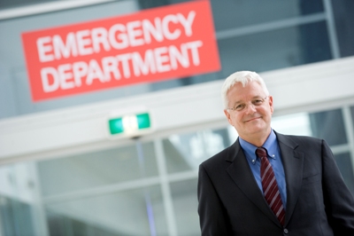 Professor Brain Kelly standing in front of the hospital emergency department