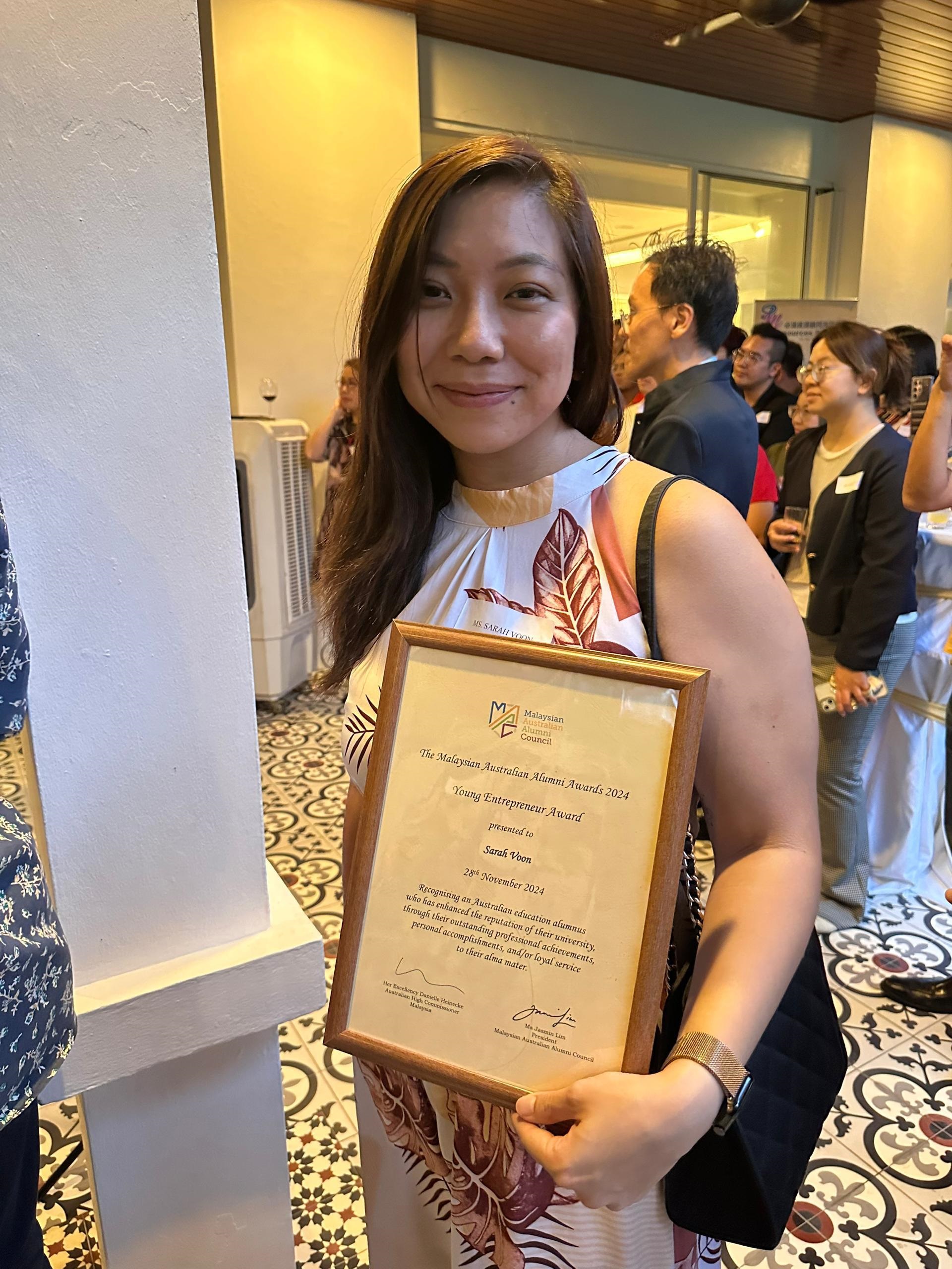 Ruyen Sarah Voon with her award
