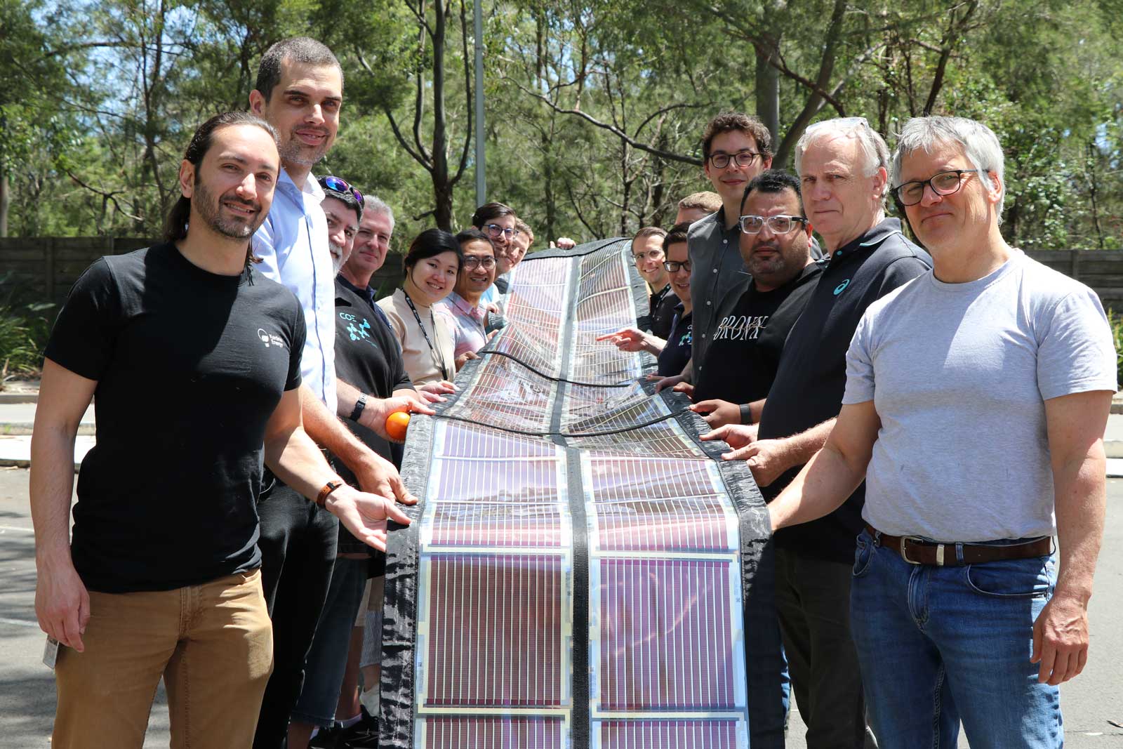 The COE team in Newcastle holding up a roll of Printed Solar designed for the Coldplay concert.  The COE team in Newcastle holding up a roll of Printed Solar designed for the Coldplay concert.