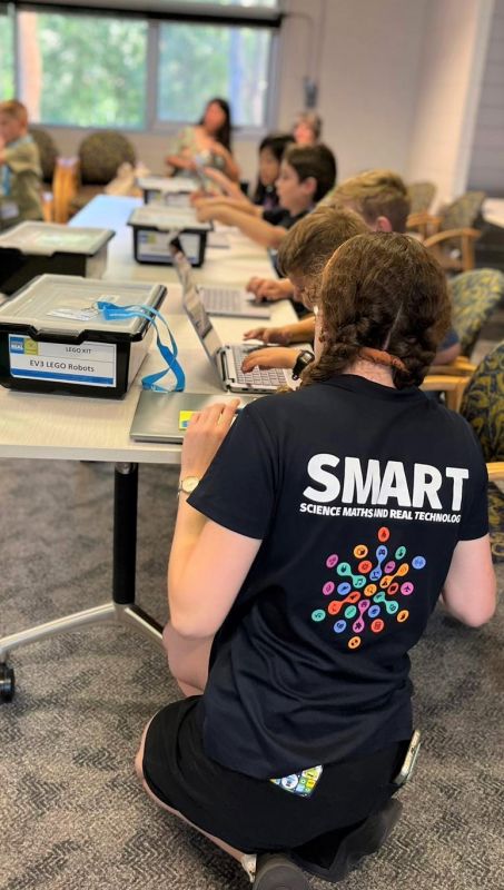 Sharni  assisting student with coding