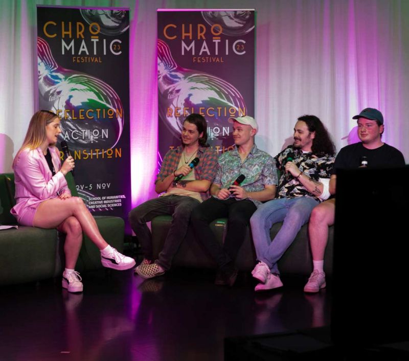 A group sitting on a couch being interviewed