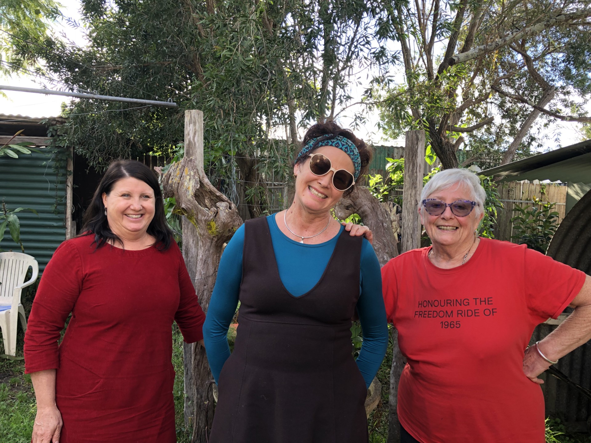 (L-R) Prof Kate Senior, Dr Jacqueline Wright, Nona Harvey three middle-aged smiling women standing in a garden