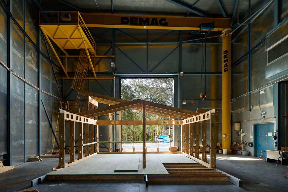 Fast Slow prototype stands in a large industrial shed