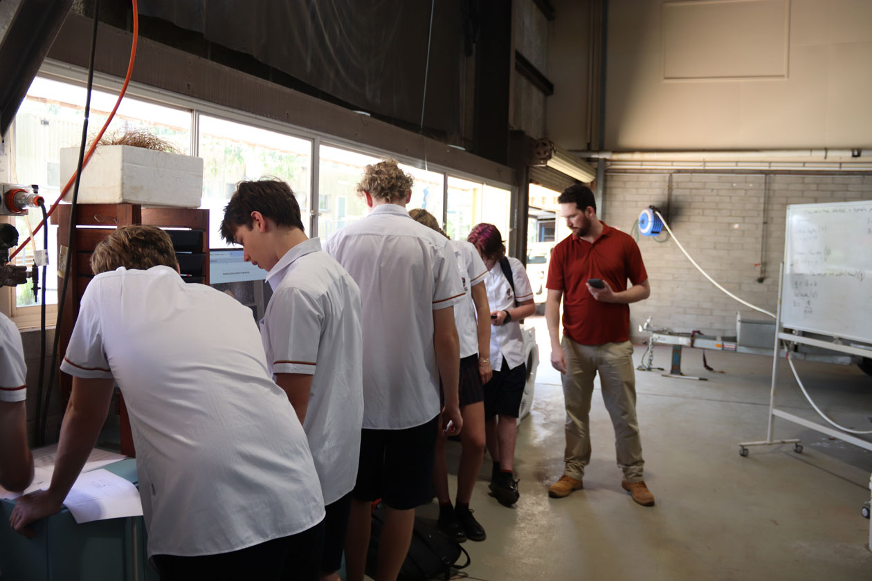 Students complete calculations on pieces of paper