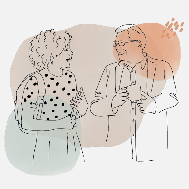 A photo of a student speaking to a chaplain over a cup of coffee