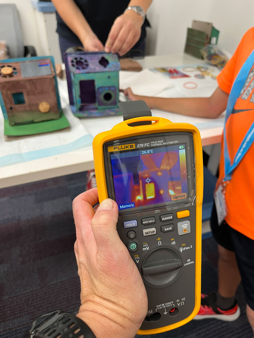 A thermal camera being used to assess the heat in the eco-houses