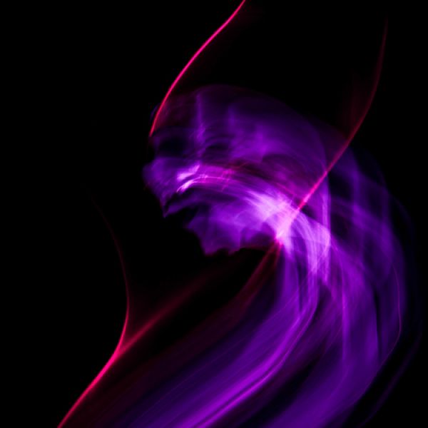 Abstract neon pink and purple light trails swirl against a black background, creating a dynamic, wave-like glow with a futuristic appearance. - Saturday 31 October 2026