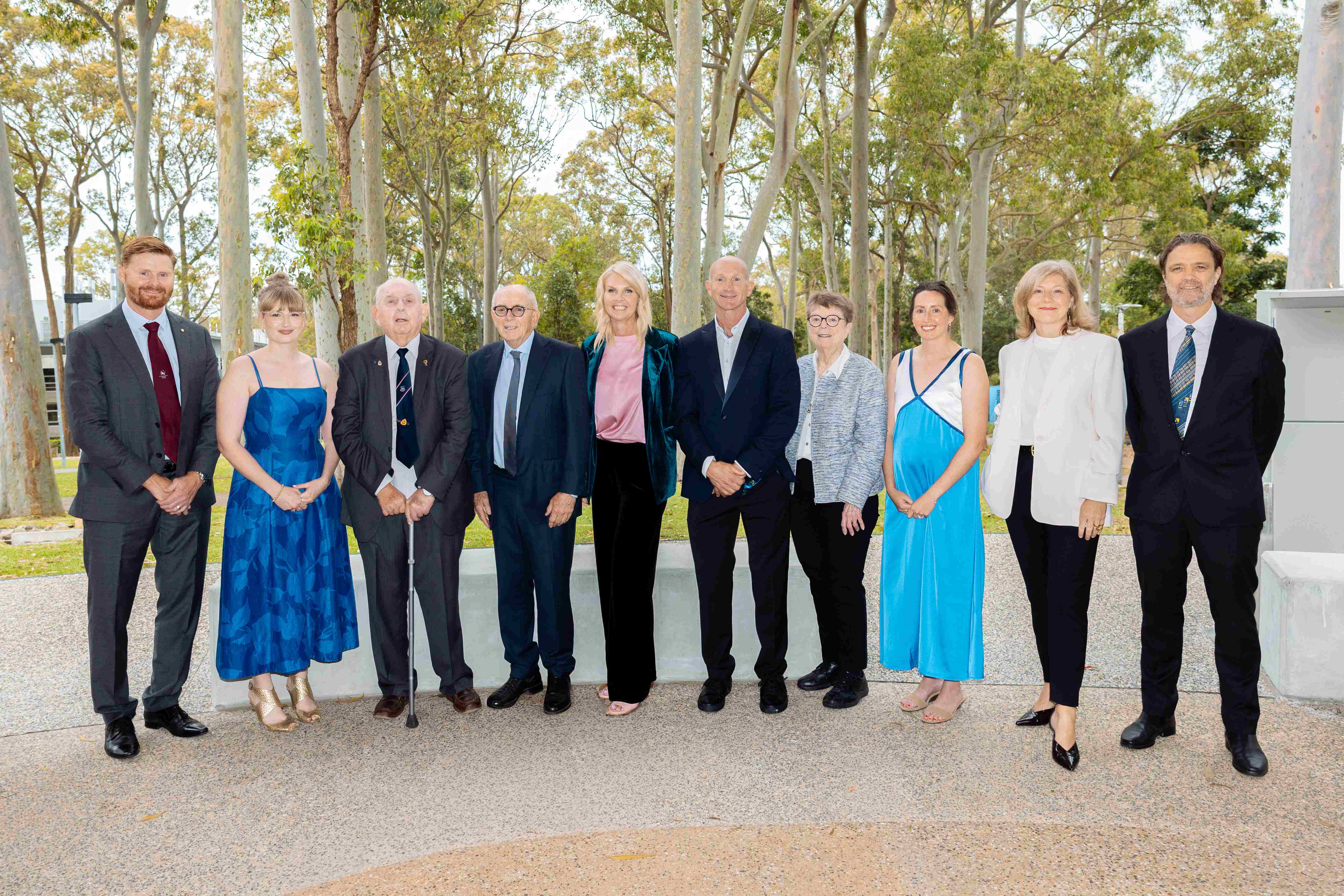 The award winners stand together in a group photo