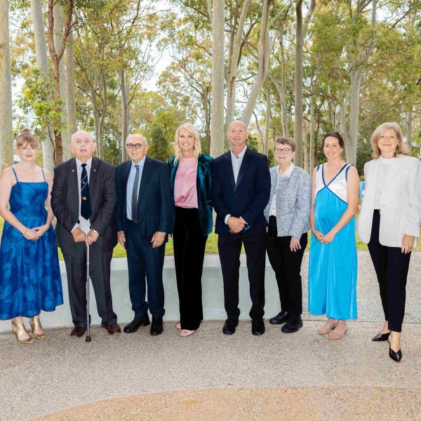 The award winners stand together in a group photo. University celebrates graduates making an impact in media, literature and health
