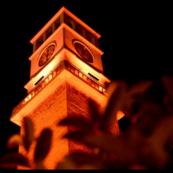 Clock tower lit up orange