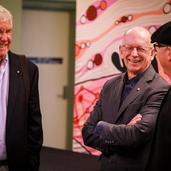 Invited guests speaking with Professor John Maynard