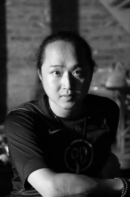 Black and white portrait of Choreographer, Wang Peng