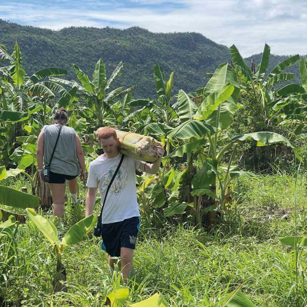 Luke Kiehne, shown here on his supervised study trip to Thailand, swapped his life on the family farm in Glen Innes to study a degree in Nursing and says receiving the Andrew Brown Sport Scholarship in 2022 was an amazing privilege and honour. 