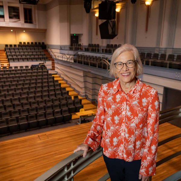 Helen English Helen English standing in the Newcastle Conservatorium concert hall