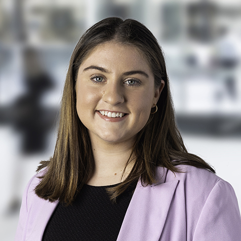 Sophie is pictured in a lilac blazer smiling 