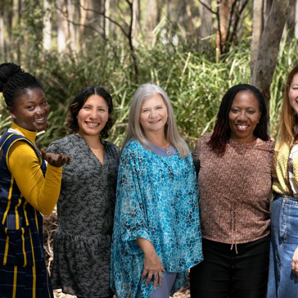Three UNESCO Chair scholars stand with Prof Penny Jane Burke and Dr Gifty Gyamera amongst the trees on camous. Welcome to three UNESCO Chair Scholars