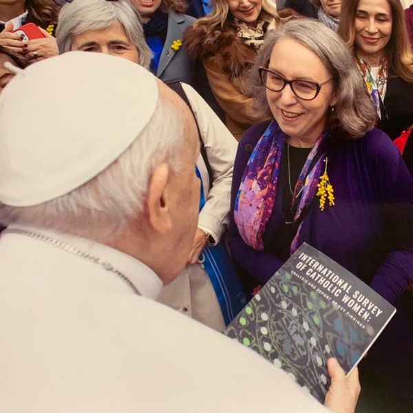 Dr Tracy McEwan hands Pope Francis a copy of the International Survey of Catholic Women (c) Vatican Media