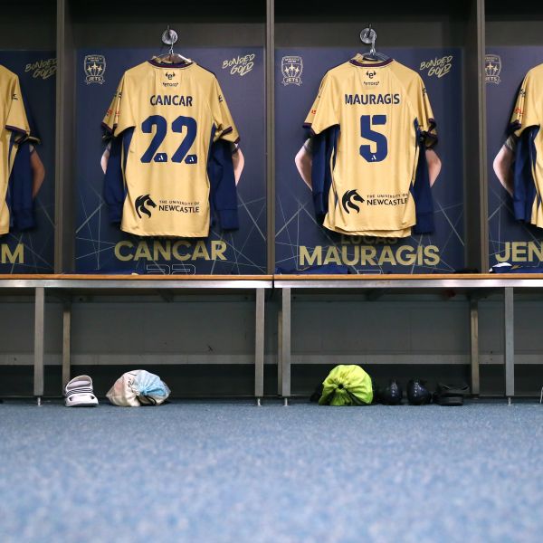 Jets game shirts hanging in locker room
