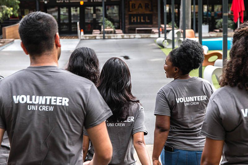 A group of volunteers walking down stairs