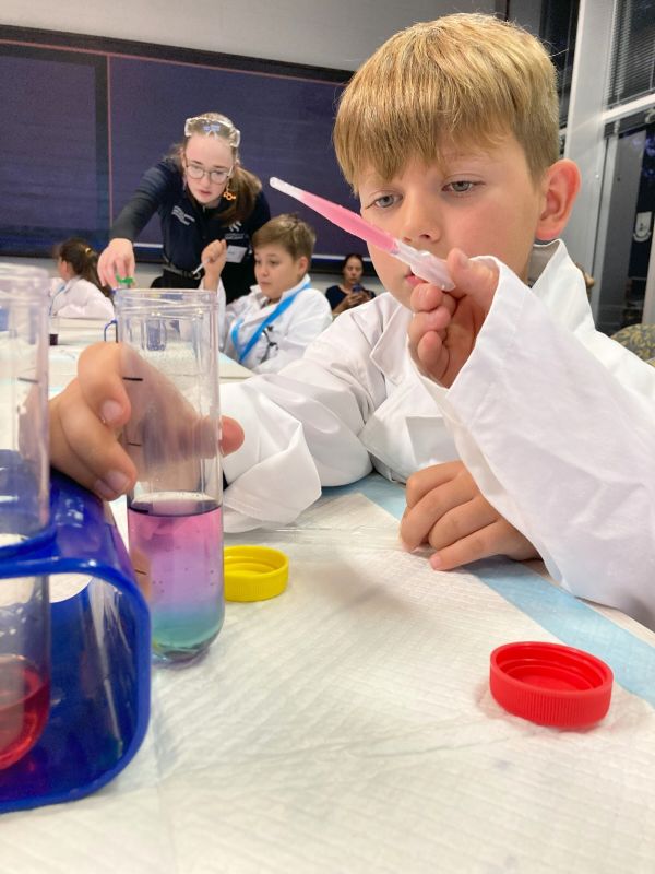 Student holding test tube