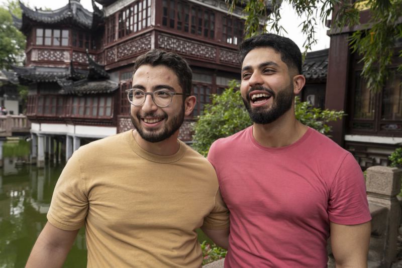 Two men smiling together