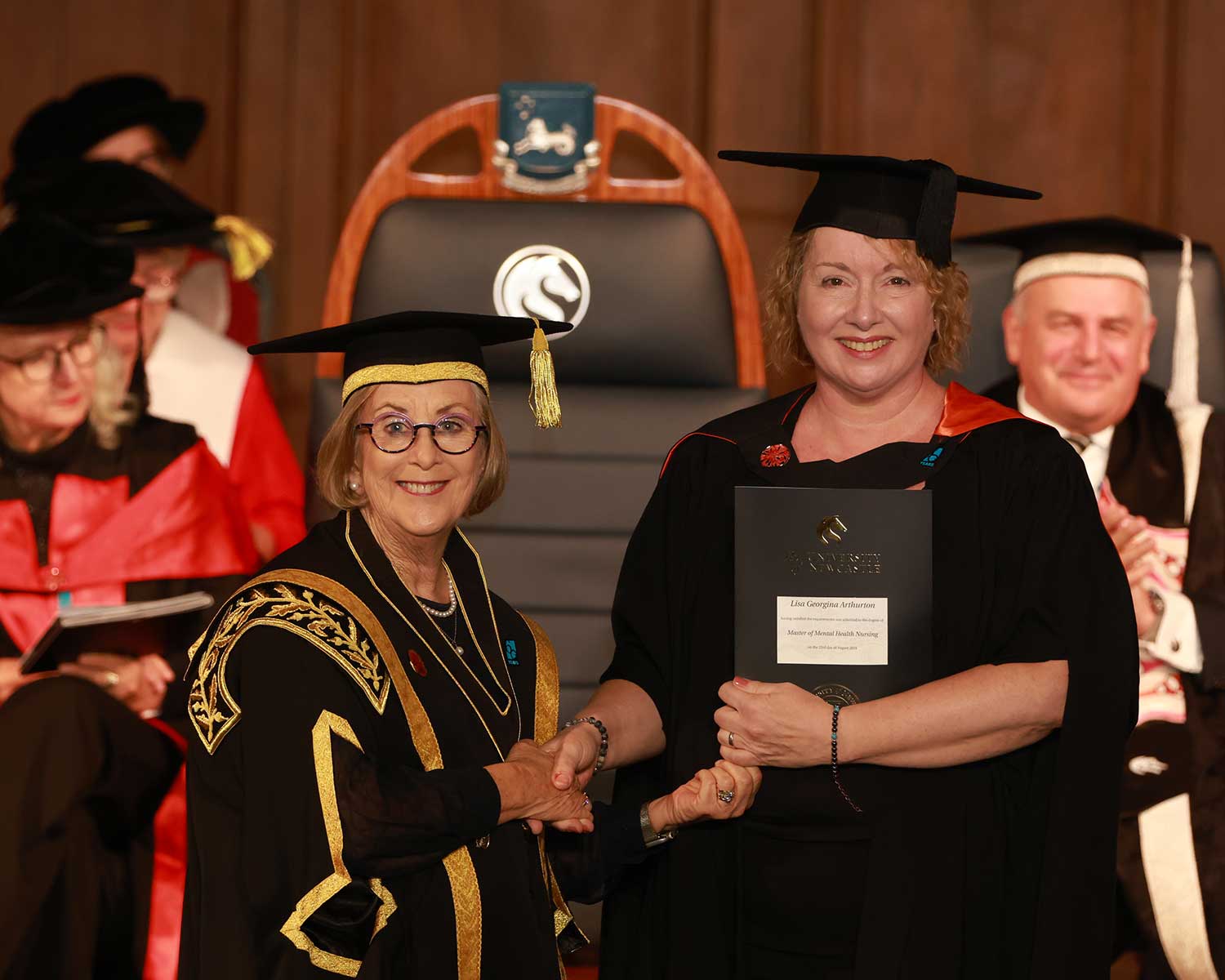 University Chancellor, the Hon Patricia Forsythe, congratulates Lisa Arthurton at her graduation.