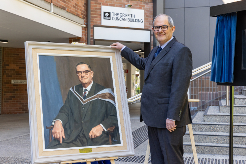 Alan Broadfoot with a portrait of Griffith Duncan