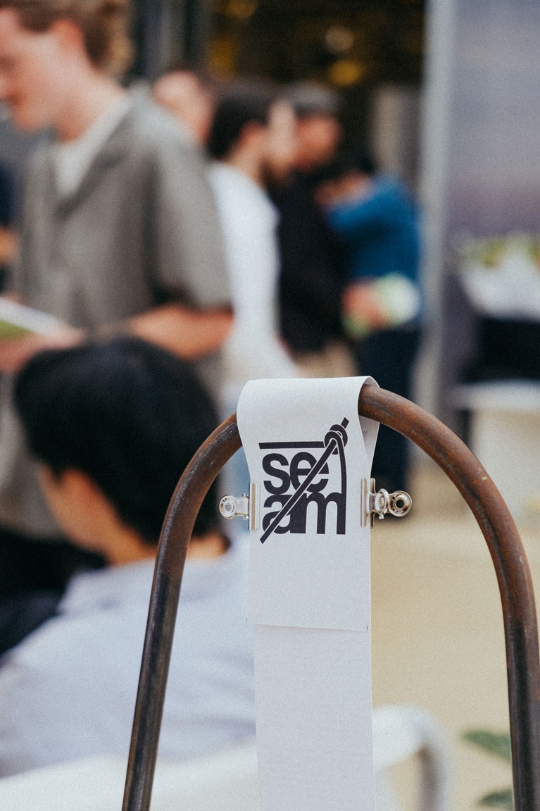 The Seam logo is seen on a piece of cloth