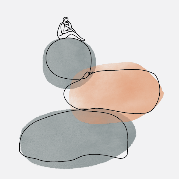 A group of 3 rocks stacked on top of each other, with a person sitting on top of the third rock