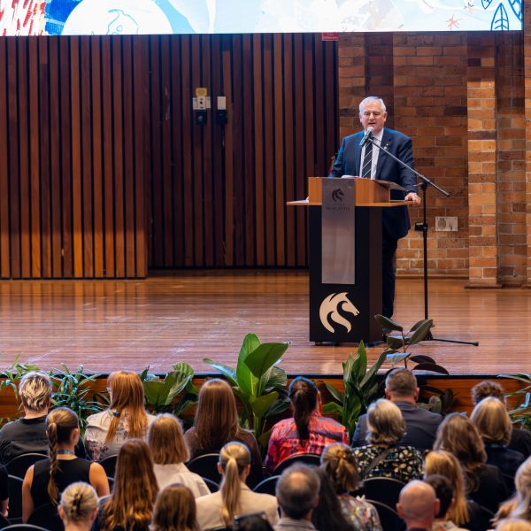 Professor Alex Zelinsky AO addresses staff on stage at the launch of the new strategic plan