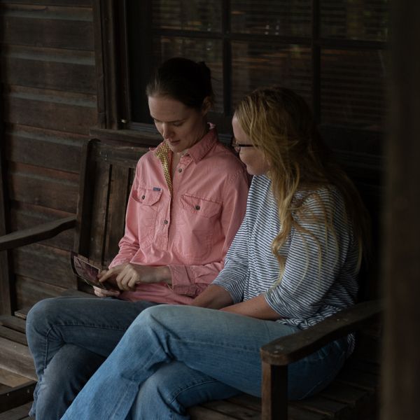 Sophie and Hedda look at Sophie's old photos of the farm