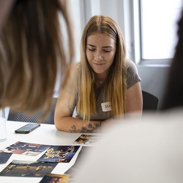 Ma & Morley Scholar looks over images on desk