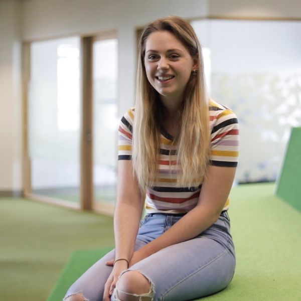 student, Gabby, sitting at NUSpace. Transformative early entry into Law supports people from a refugee background