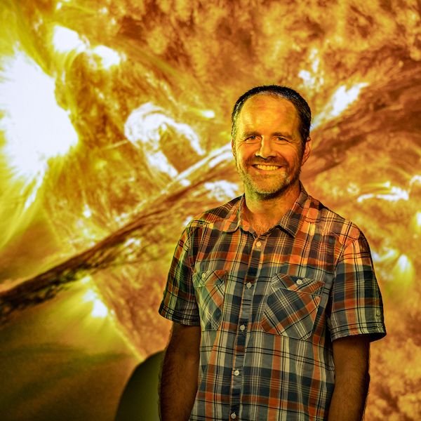 David-Pontin-6691.jpg David Pontin standing in front of projection of the sun