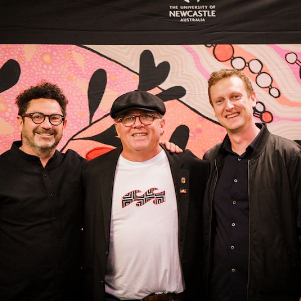 Distinguished guests either side of Professor John Maynard