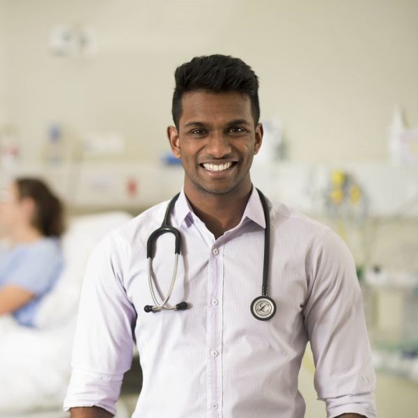 Image of male junior doctor smiling at the camera