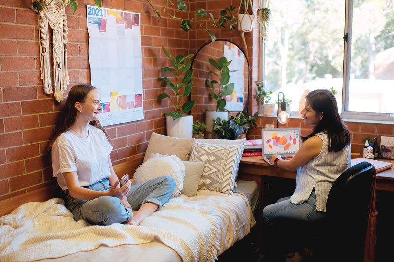 Residents studying in International House bedroom