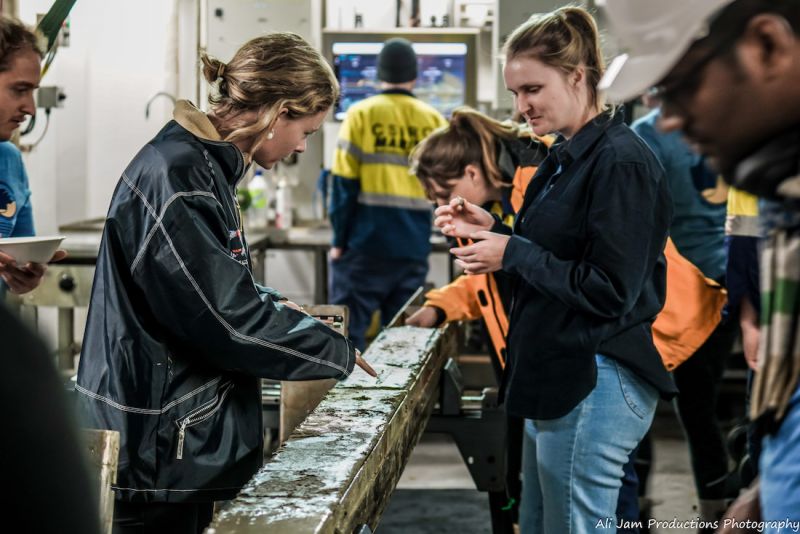 Students onboard the RV Investigator getting hands-on collecting data for their research