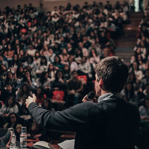 Lecturer speaking to class - Debates