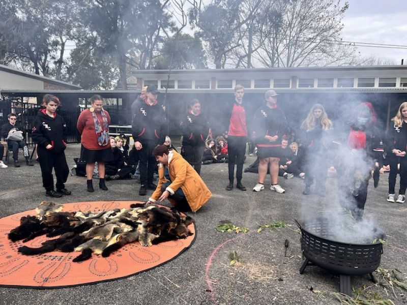 High school students in school grounds attending a smoking ceremony