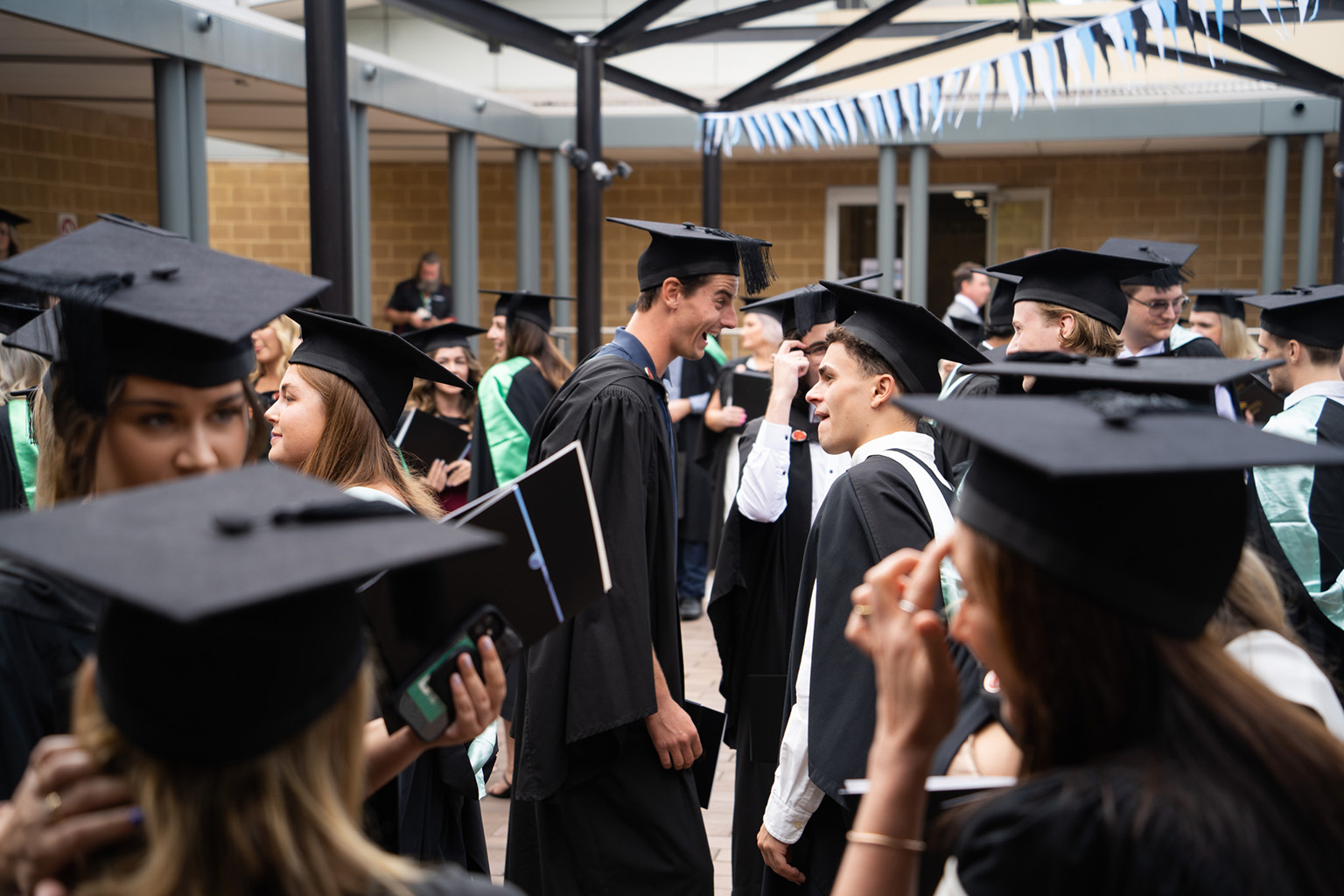Students gather after graduation