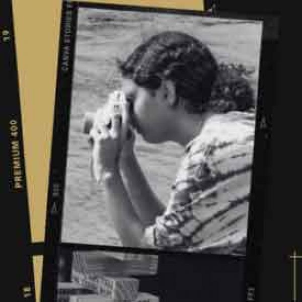 NNN thumbnail polaroid picture of student taking photo