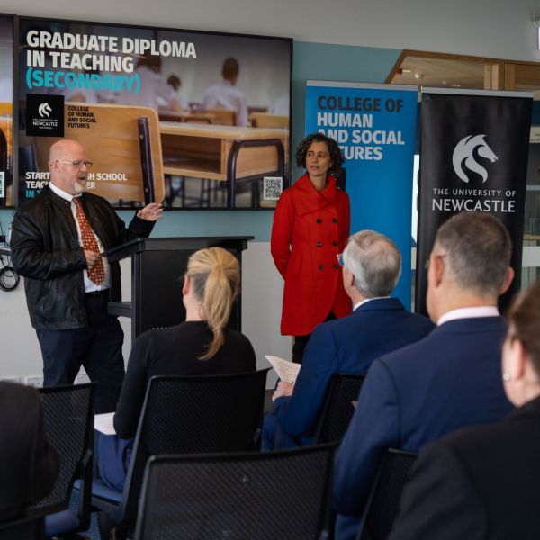 A group of people look on as Associate Professor Robert Parkes - School of Education and Associate Professor Elena Prieto-Rodriguez - School of Education present. University of Newcastle introduces Graduate Diploma to fast track path to high school teaching 