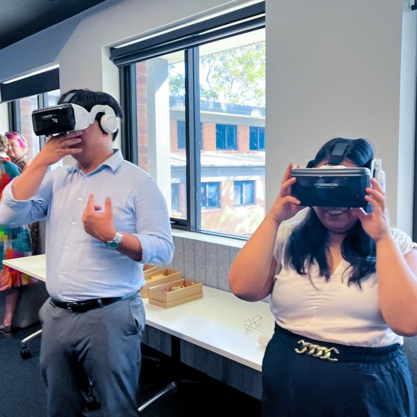 Two students wear Virtual Reality goggles that simulate the classroom environment. School of Education Launches 360° Recorded Lessons for Maths Retraining Students