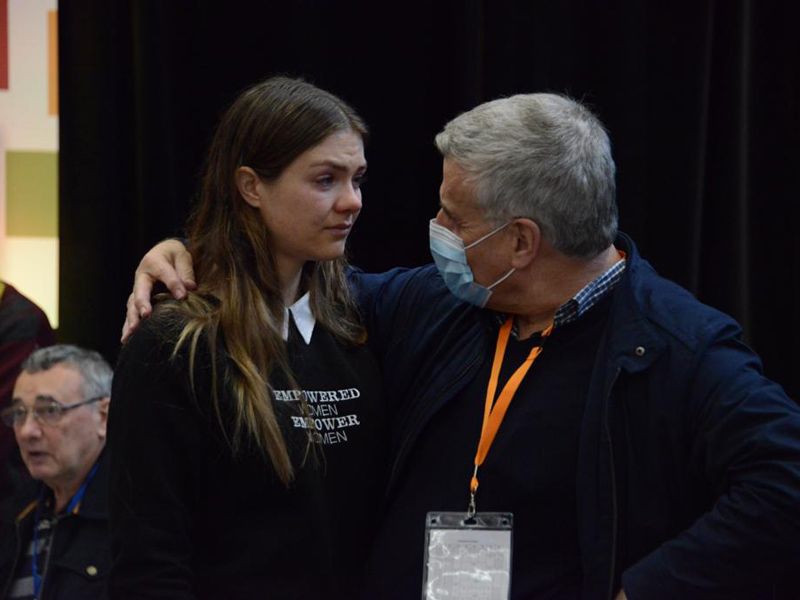 Maddy Forde comforted by Fr James McEvoy after motions to empower women failed at plenary council (c) Fiona Basile