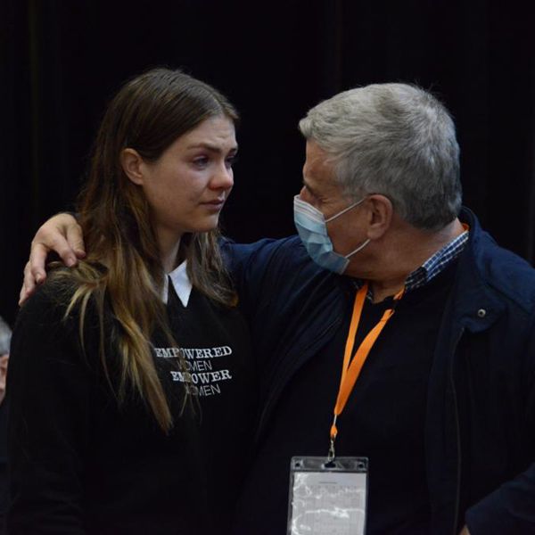 Maddy Forde comforted by Fr James McEvoy after motions to empower women failed at plenary council (c) Fiona Basile