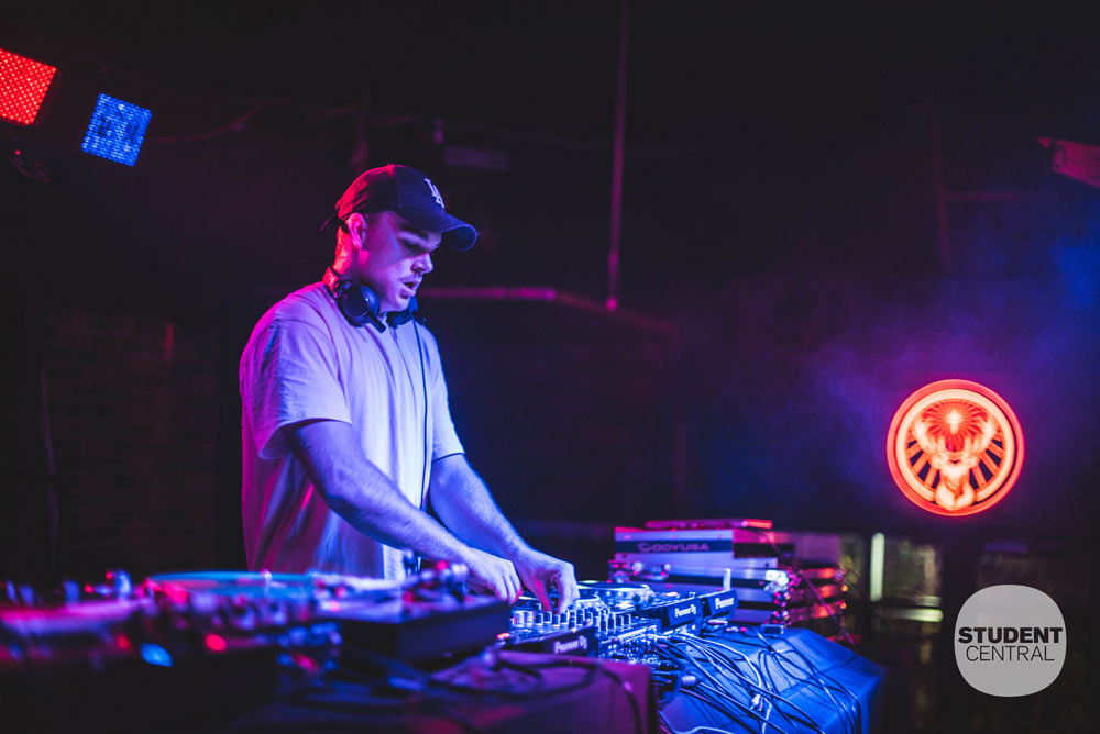 Student DJing at Bar on the Hill