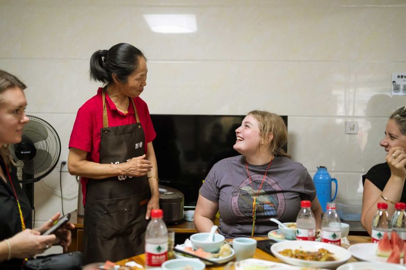 2022 Ma & Morley Scholar, Emma Dubos, enjoying a meal in a local family home, Liangzhu Community, Hangzhou, China 