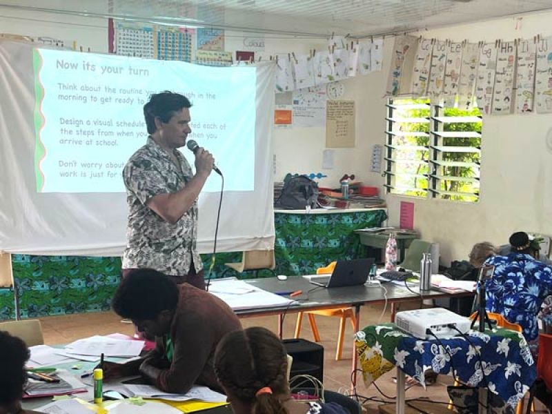 Professor Christopher Boyle teaching in a classroom
